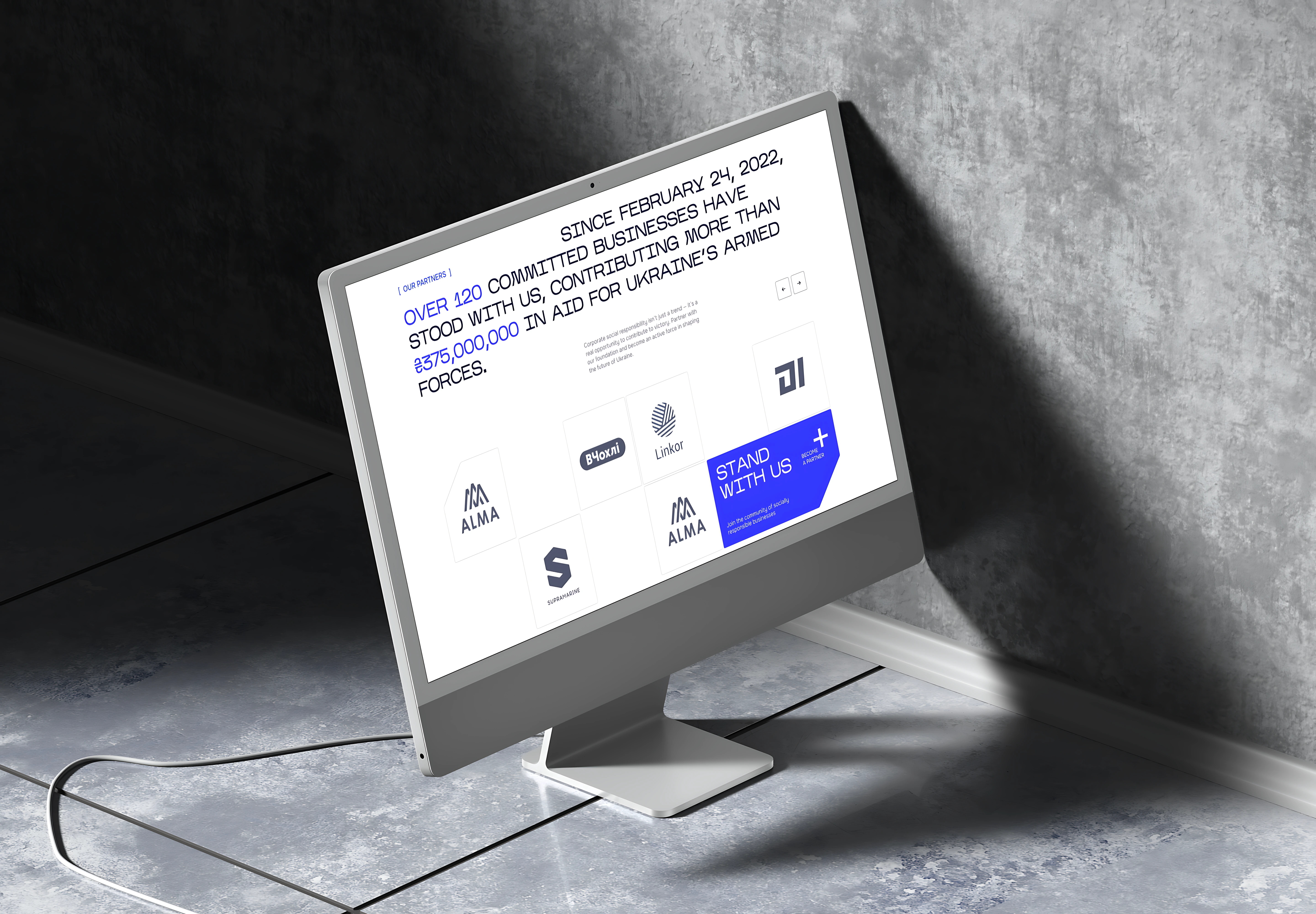iMac mockup showing Wave'91 Stand With Us partners page